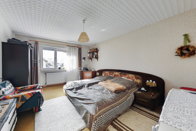 Schlafzimmer_1 Einfamilienhaus Langg�ns