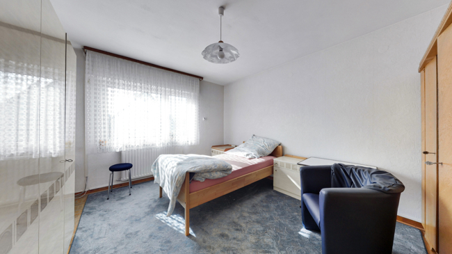 Schlafzimmer_2 Einfamilienhaus Langg�ns